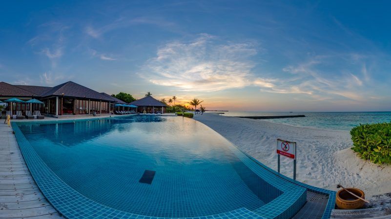 atmosphere kanifushi maldives sunset pool bar