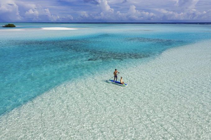 pullman maldives maamutaa couple paddle activity