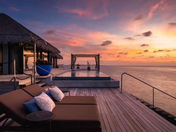 velaa private island maldives ocean pool house sunset view